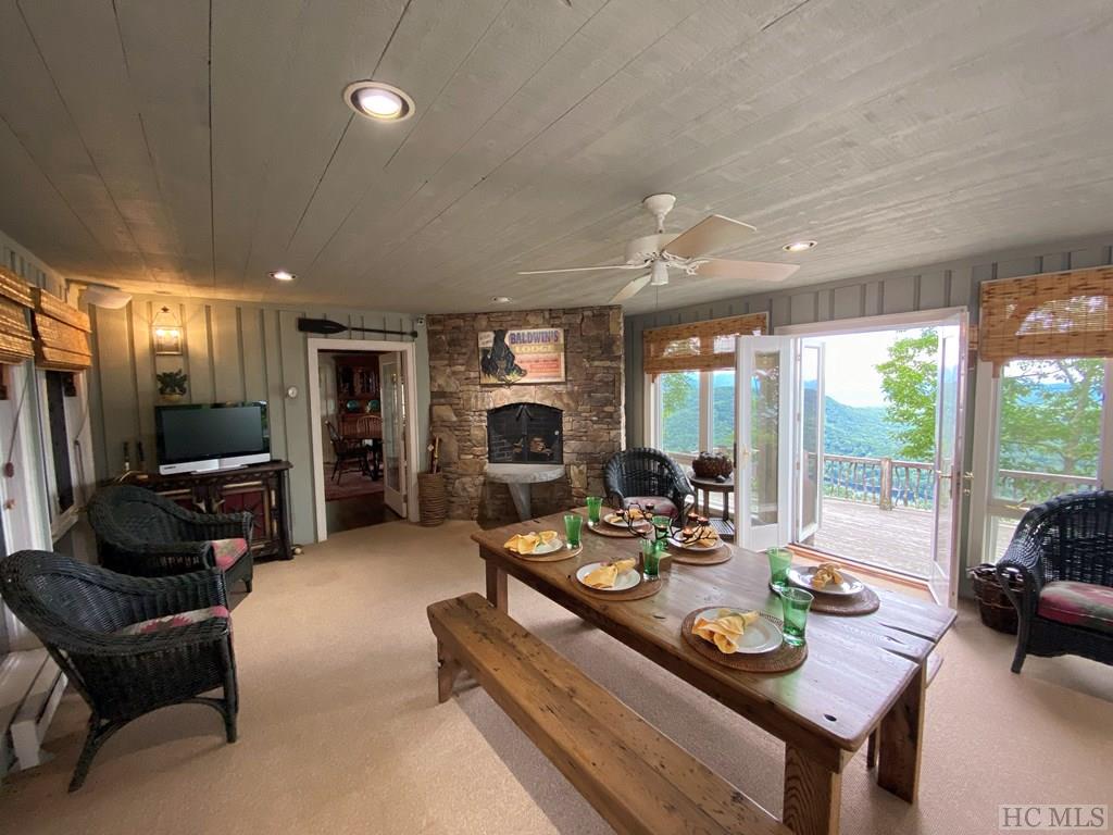 All weather porch room with fireplace and deck